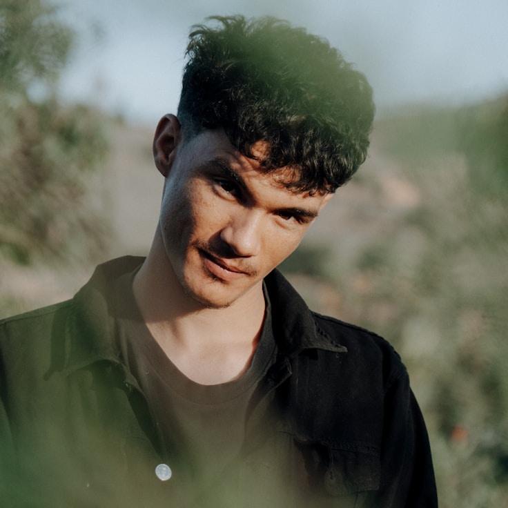 Kaveri Mehta, Lead Design Curator at River Cascade Silver, reviewing corporate floral arrangements